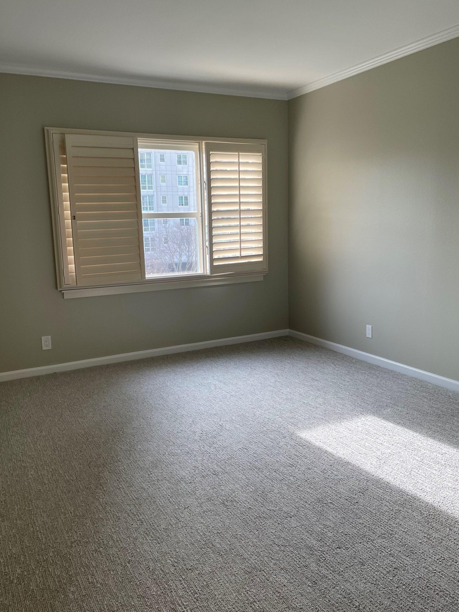 Condo 310 primary carpeted bedroom