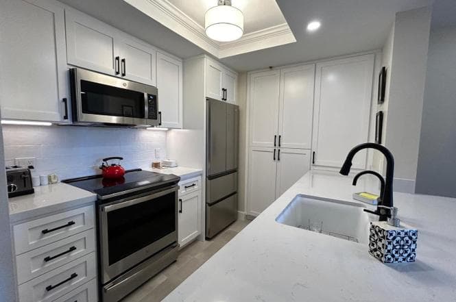 Renovated kitchen with white cabinetry