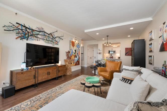 Living room with couch, media stand and tv