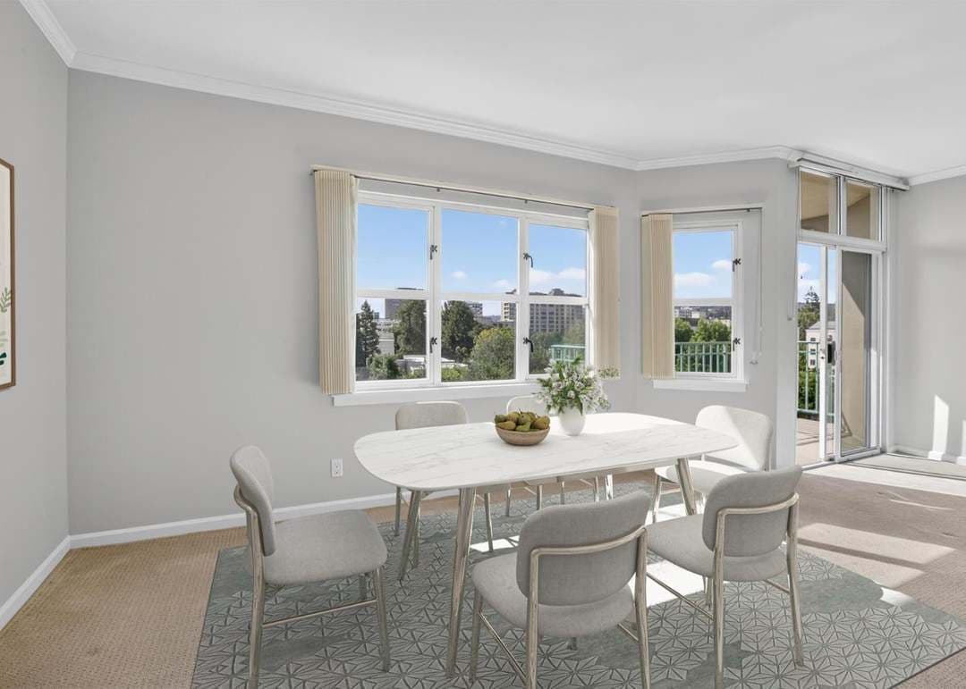 Dining room with natural light and four person dining table