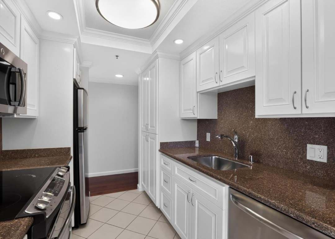 Renovated kitchen with white cabinetry